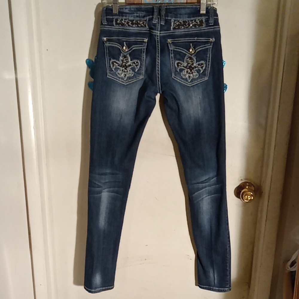 Woman's jeans with Bling,Bling Blue and distressed. Good stretch.